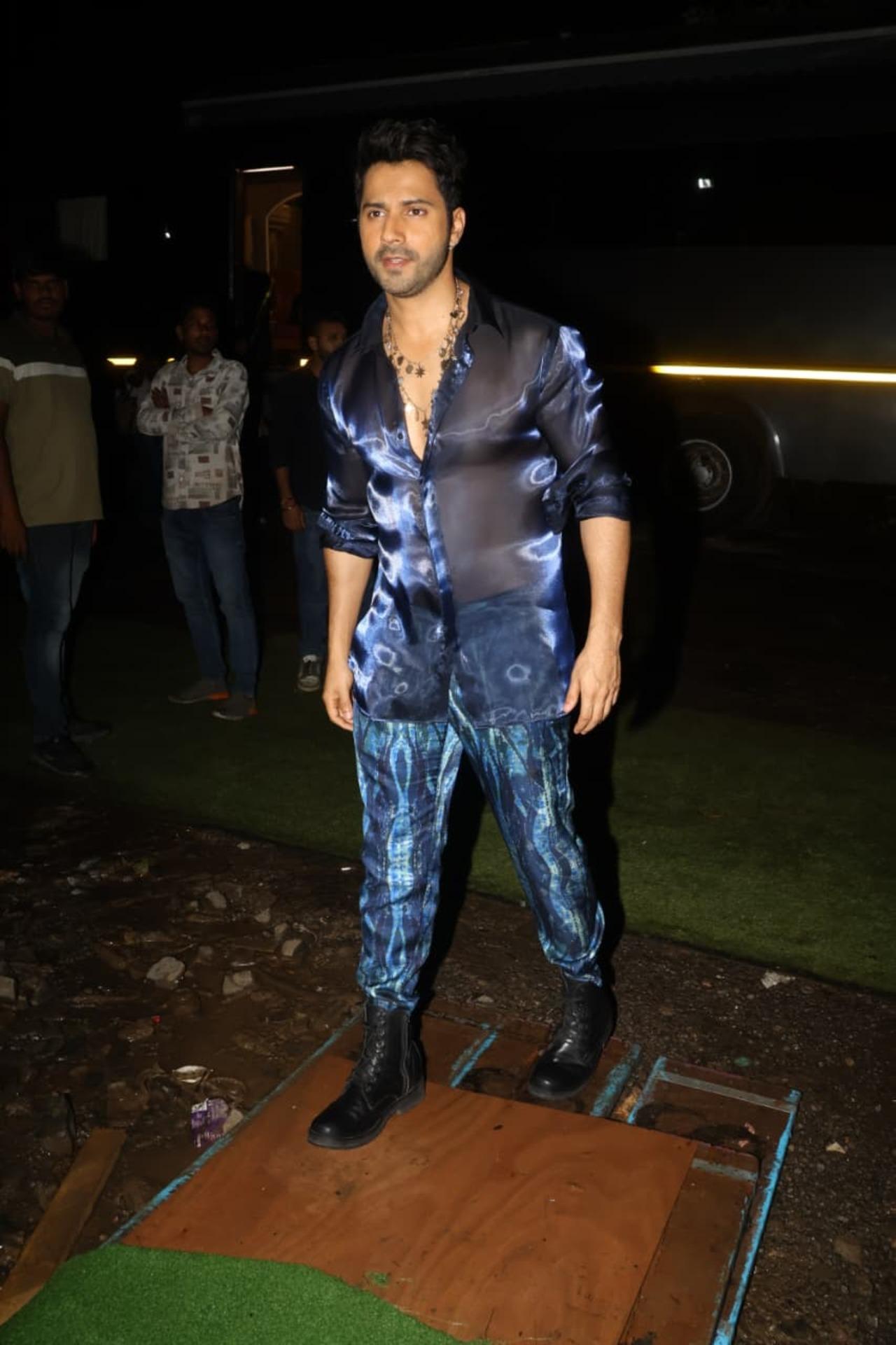 Varun Dhawan looked dapped in a black and blue attire as he was clicked on the sets for an ad shoot. The actor generously posed for the shutterbugs, 